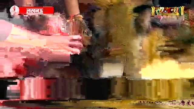 Hands are reaching for something, perhaps a blessing, as a bright yellow light flares. A red banner with Hindi script hangs above the scene. Hands are reaching for something, perhaps a blessing, as a bright yellow light flares. A red banner with Hindi script hangs above the scene.