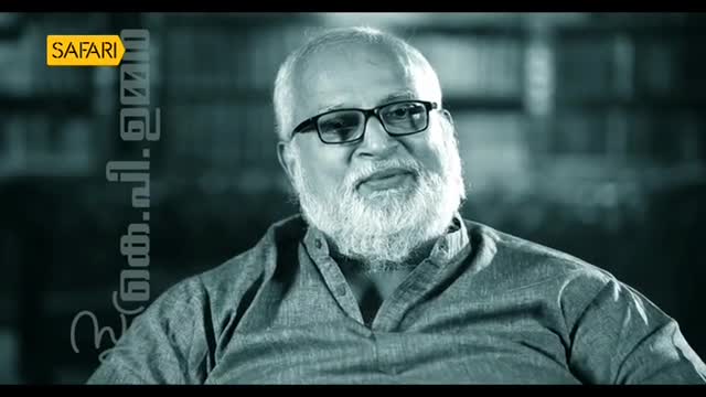 The man in the frame, wearing glasses and a full white beard, is speaking on Safari TV. The channel's logo is visible in the corner.

