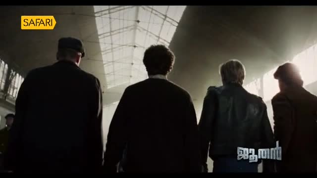 Four men walk away from the camera, their backs to us, toward a bright, high ceiling. The Safari TV logo sits in the top left corner, and text appears at the bottom right.
Four men walk away from the camera, their backs to us, toward a bright, high ceiling. The Safari TV logo sits in the top left corner, and text appears at the bottom right.