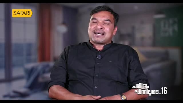 A man in a black shirt is speaking, his mouth open as he looks upwards. The Safari TV logo is visible in the corner.
A man in a black shirt is speaking, his mouth open as he looks upwards. The Safari TV logo is visible in the corner.