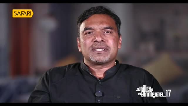 A man in a black shirt is speaking, his mouth moving as he addresses the camera. The Safari TV logo is visible in the upper left corner, and text in Malayalam is displayed below.
A man in a black shirt is speaking, his mouth moving as he addresses the camera. The Safari TV logo is visible in the upper left corner, and text in Malayalam is displayed below.