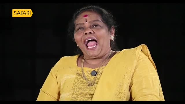 The woman in the yellow top has her mouth wide open, likely speaking on Safari TV. Her expression suggests excitement or surprise.
