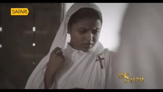 A young woman in a nun's habit adjusts her veil, her gaze downcast. A golden "Safari" logo sits in the upper left corner, and "His Story" appears in the lower right.