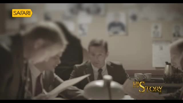 A group of men in suits are gathered around a table, looking at documents. The Safari channel logo is visible in the top left corner, and "History" is emblazoned on the bottom right.