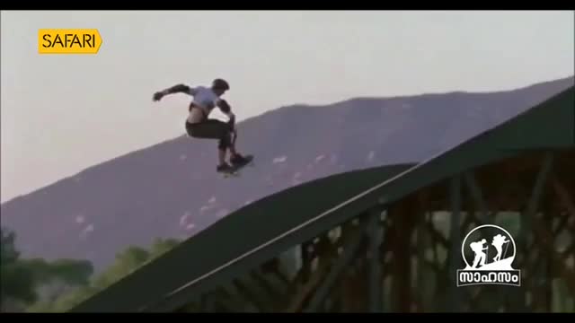 A skateboarder soars through the air, suspended above a ramp. The "Safari" logo suggests this might be from a program in India.
