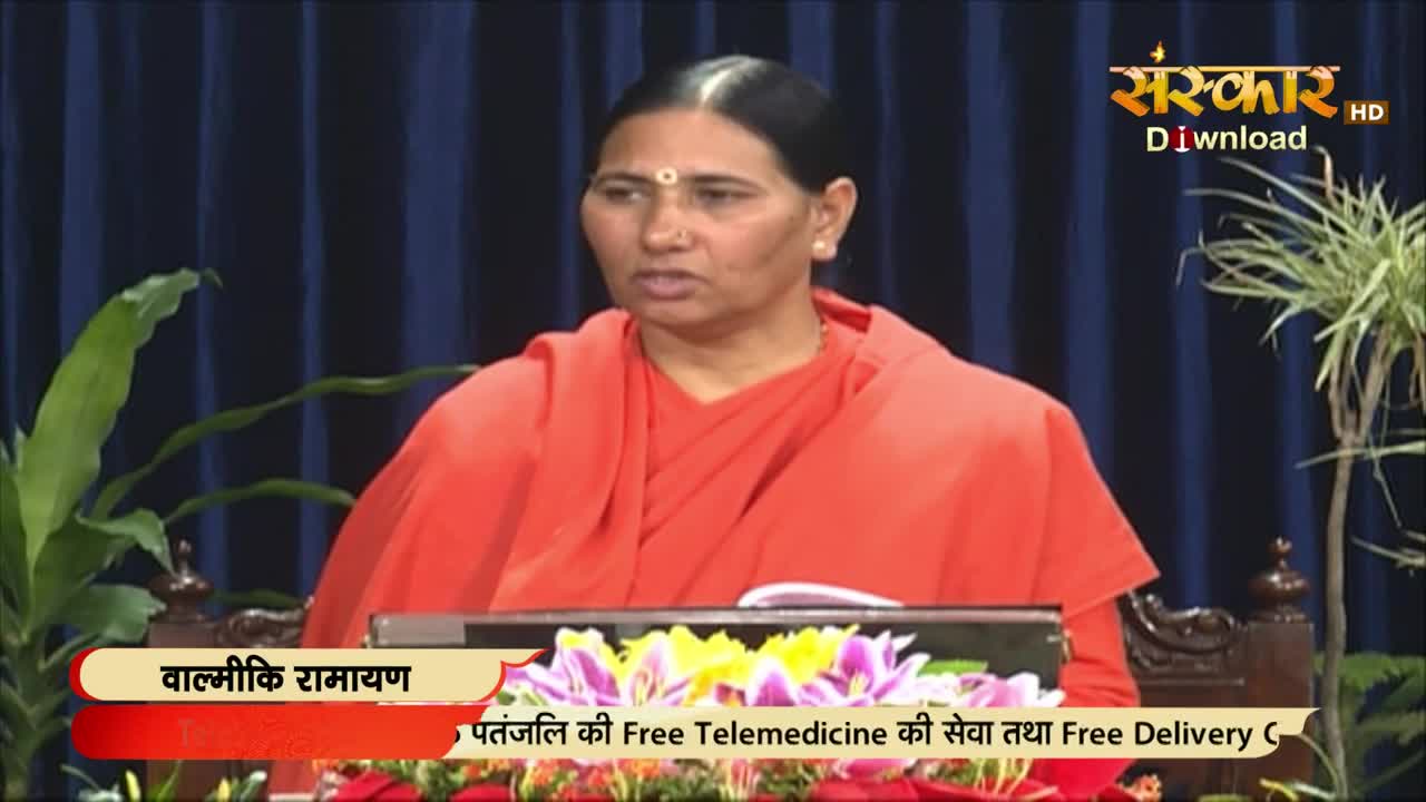 A woman in an orange robe speaks, her gaze directed toward the camera. Behind her, the Sanskar TV logo is visible, and below, text advertises free telemedicine services in Hindi.
