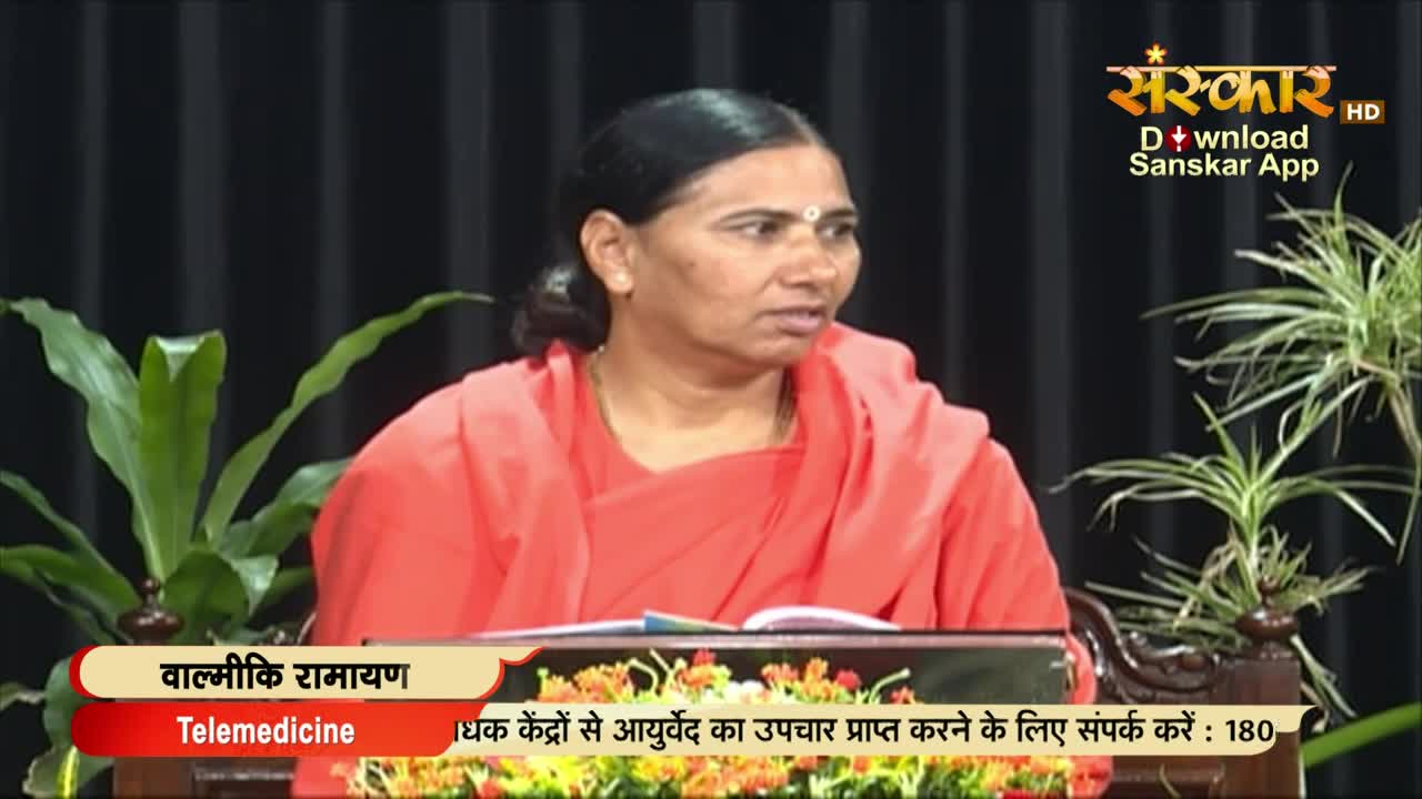 A woman in an orange robe speaks, her gaze directed slightly to her left. The Sanskar TV logo is visible in the corner, and a graphic at the bottom discusses telemedicine.
