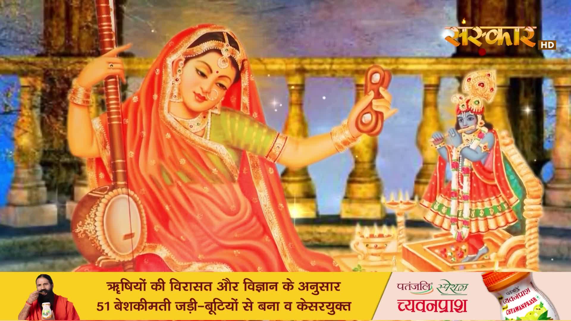 A woman in a vibrant orange sari holds a veena, her gaze soft. Nearby, a blue-skinned Krishna plays his flute, a small lamp casting a warm glow.