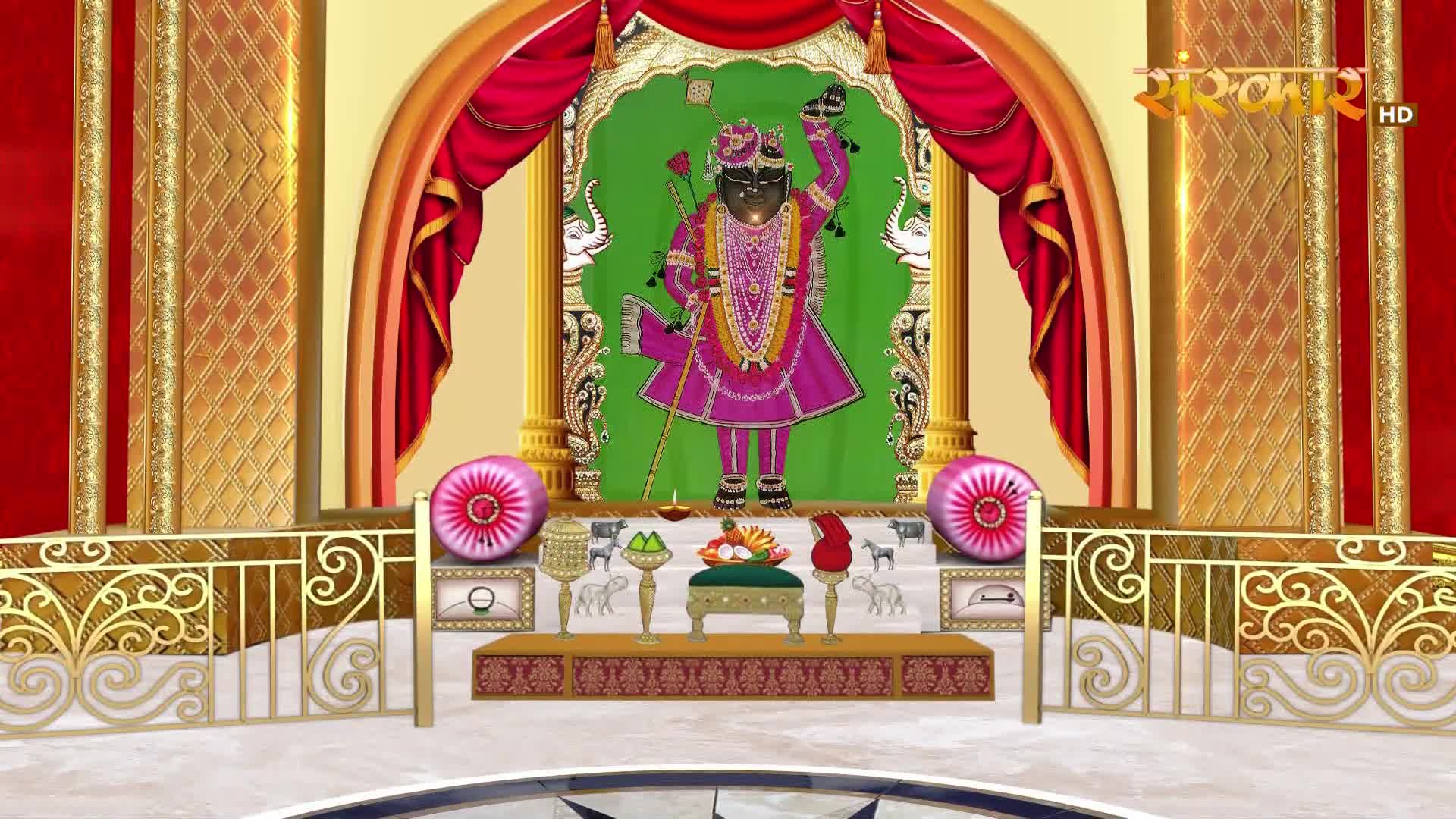 A vibrant depiction of a deity stands on a decorated altar, framed by opulent red curtains and golden pillars. The Sanskar TV logo is visible in the upper right corner.