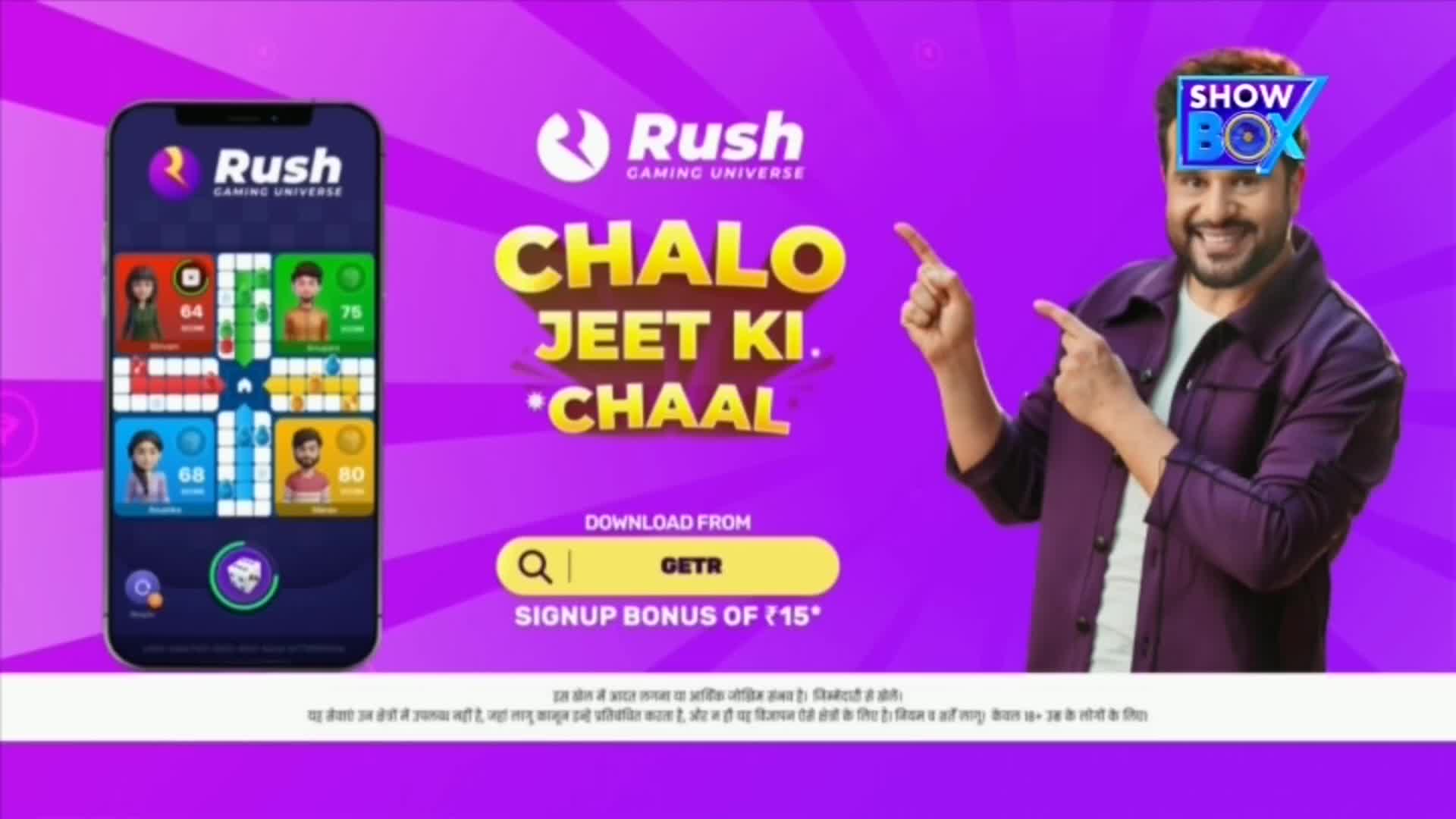 On a vibrant purple background, a man with a "SHOW BOX" logo over his head points towards text that reads "CHALO JEET KI CHAAL." To the left, a phone displays a game interface, likely a version of Ludo, from Rush Gaming Universe.
