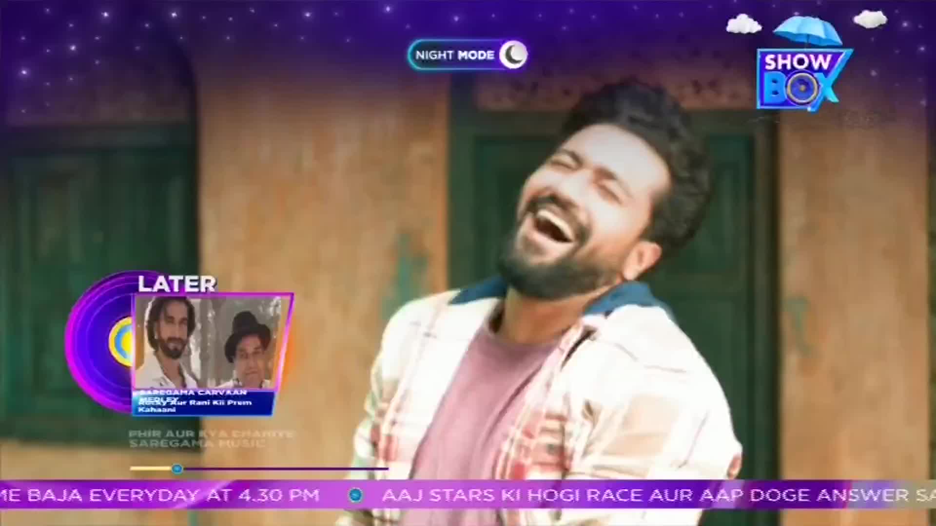 A man with a beard throws his head back, laughing heartily. The screen displays a "ShowBox" logo and a "Later" segment previewing an upcoming program.
