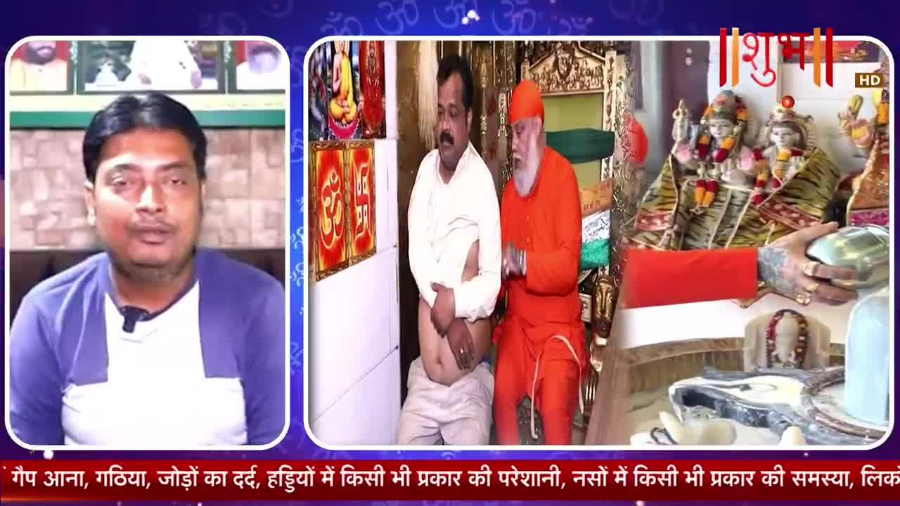 A man in an orange robe places his hand on another man's stomach as they stand before religious idols. On the left, a man in a blue and white shirt speaks directly to the camera.