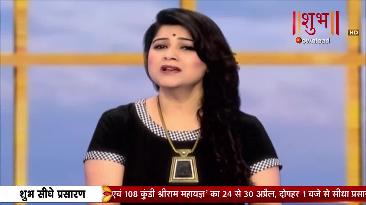 A woman with dark hair speaks directly to the camera, her expression earnest. A graphic at the bottom of the screen indicates a live broadcast from Shubh TV.
