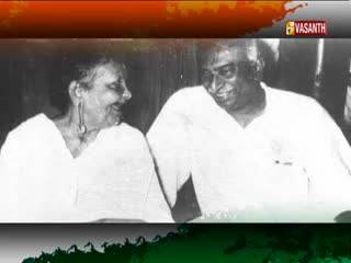 Two people, a man and a woman, are looking at each other and smiling. The Vasanth TV logo is visible in the corner.
