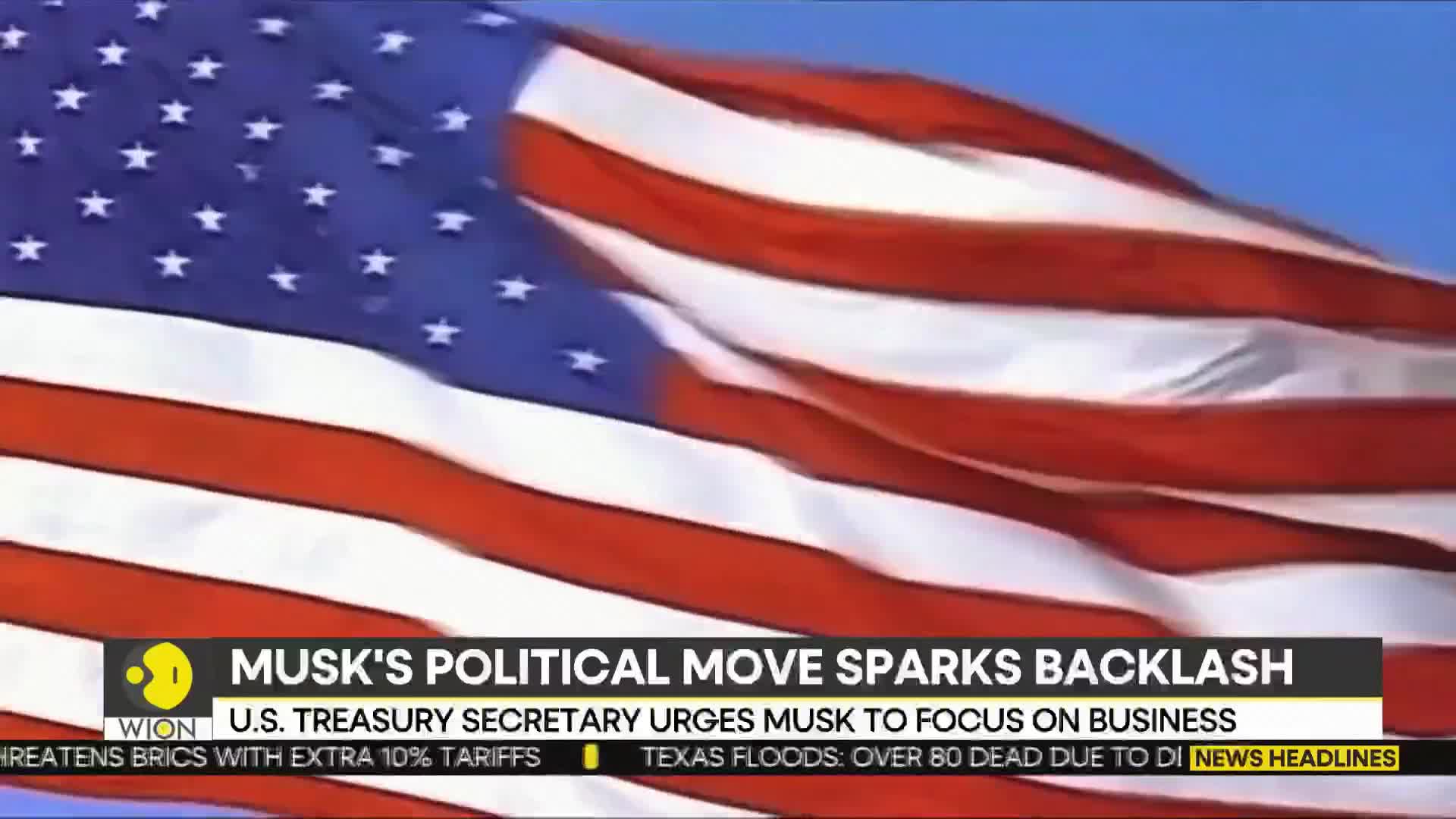 The American flag waves against a clear blue sky. Below, a WION news graphic reports on Elon Musk and the U.S. Treasury Secretary.
