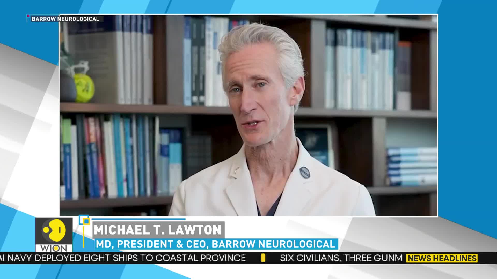 A man in a white coat is speaking, his face framed by a bookshelf. The WION logo sits in the corner, and a news ticker scrolls along the bottom.
