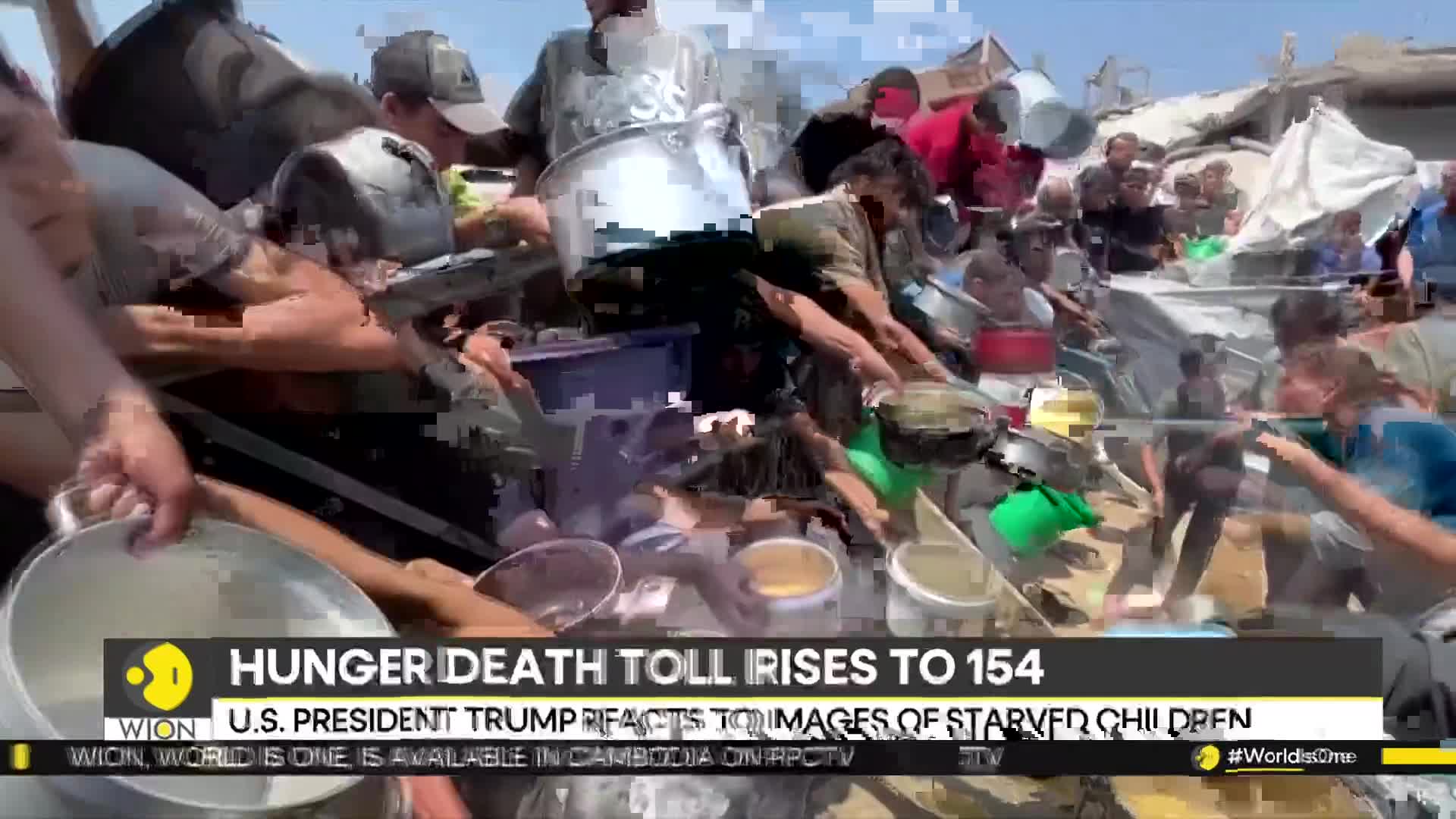 People are reaching for bowls and pots, likely to receive food, amidst a chaotic scene. The WION news banner at the bottom highlights the severity of the situation.
