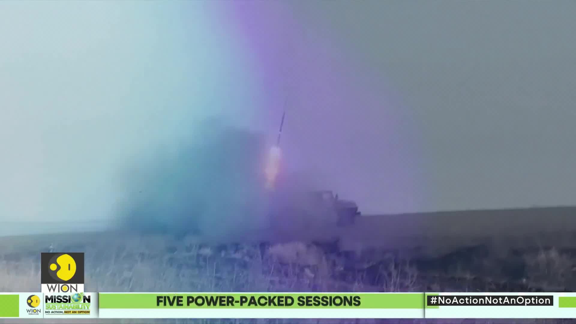 A rocket streaks skyward from a vehicle, leaving a trail of smoke and fire. The scene is framed by a news graphic from WION.
