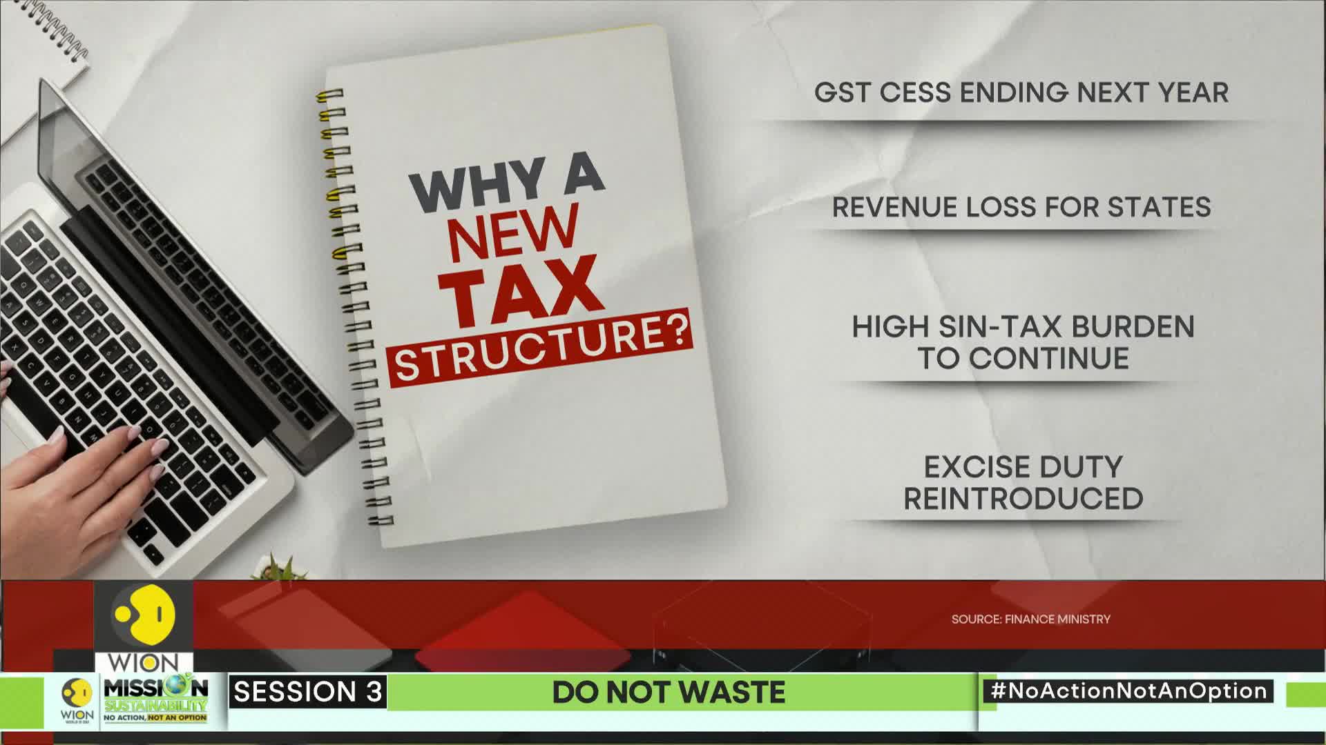A laptop and notepad sit side-by-side, with a hand poised over the keyboard. The screen displays information about a new tax structure, as presented by WION.
