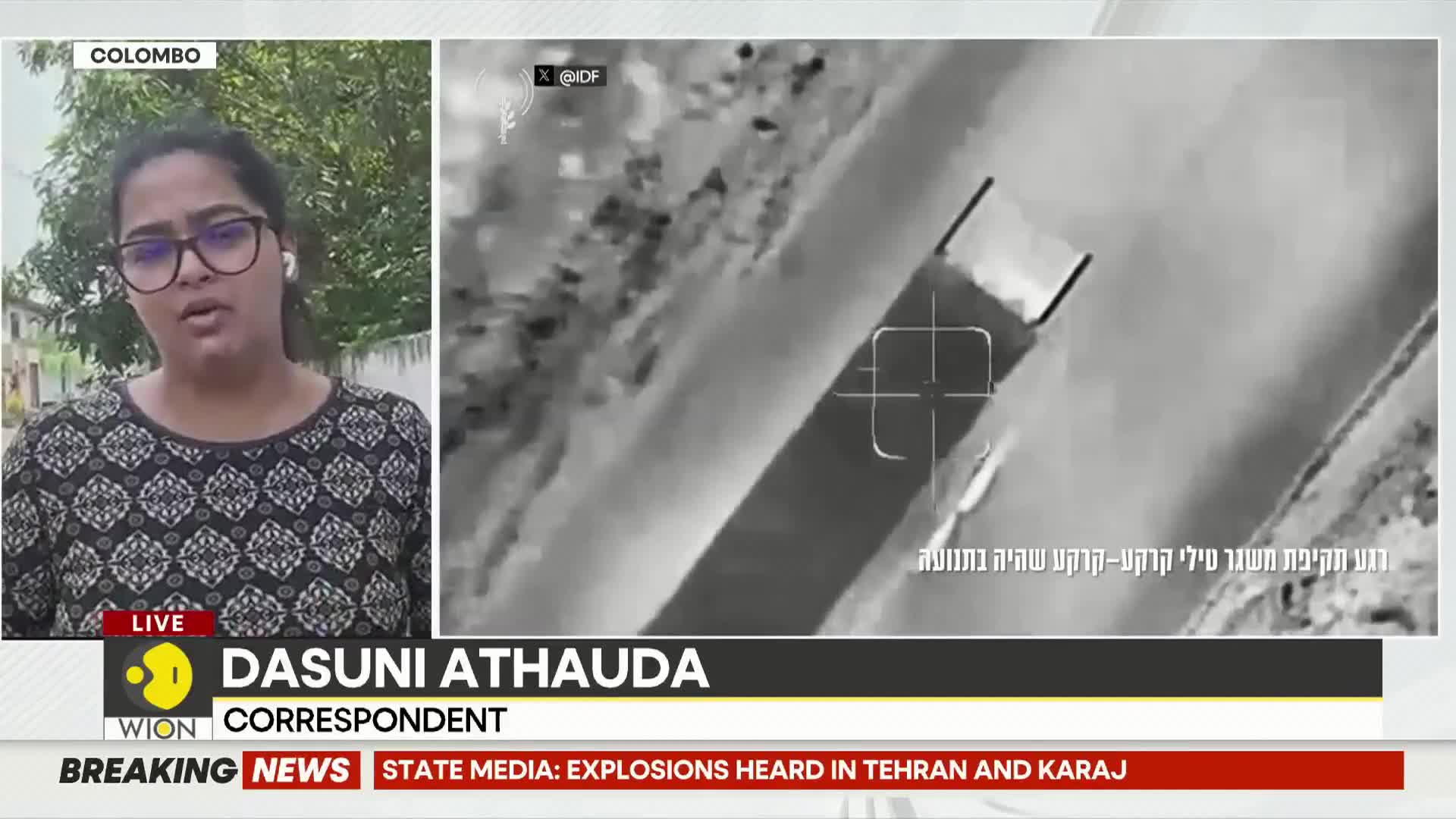 A drone's thermal camera captures a long, rectangular structure on the ground. A crosshair sight is centered on one end of the object.