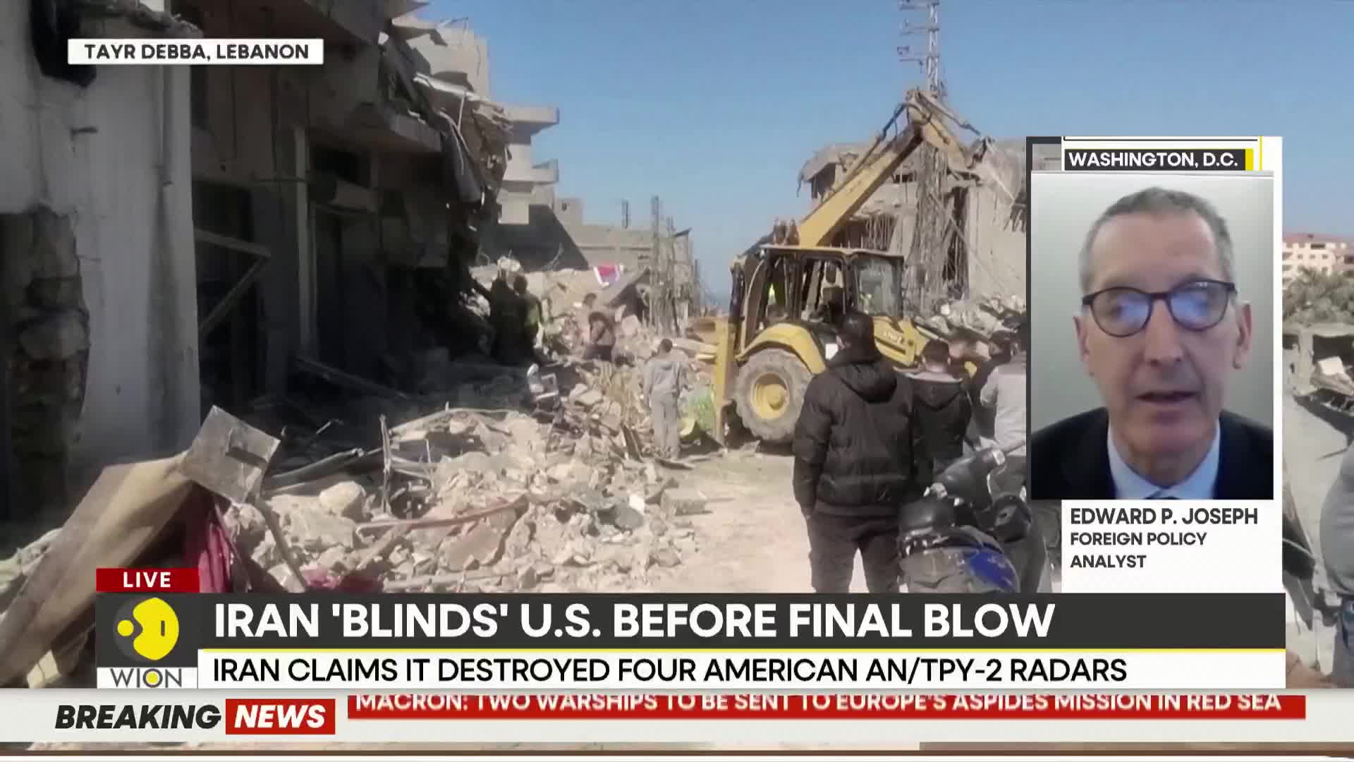 A yellow bulldozer works through a mountain of rubble in Tayr Debba, Lebanon, as people watch. A WION news overlay reports Iran's claims about destroying US radars.