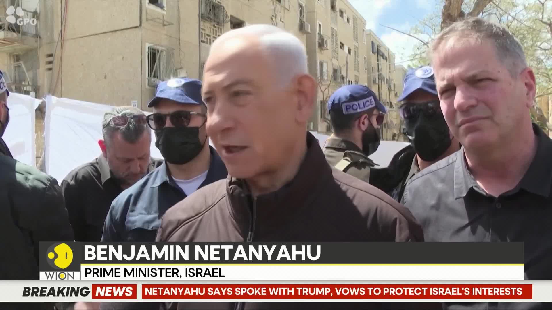 Benjamin Netanyahu, Prime Minister of Israel, speaks with a group of men, some in police uniforms. A WION news banner scrolls across the bottom of the screen.