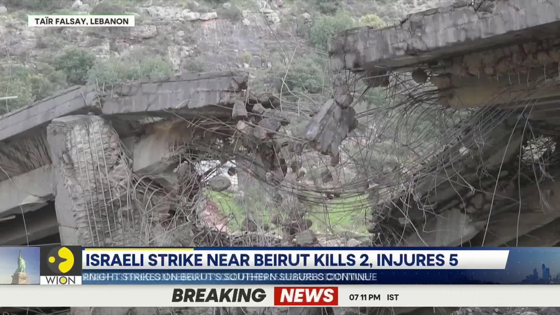 The concrete structure lies in ruins, its rebar twisted and exposed. Debris is scattered everywhere, a testament to the recent strike.