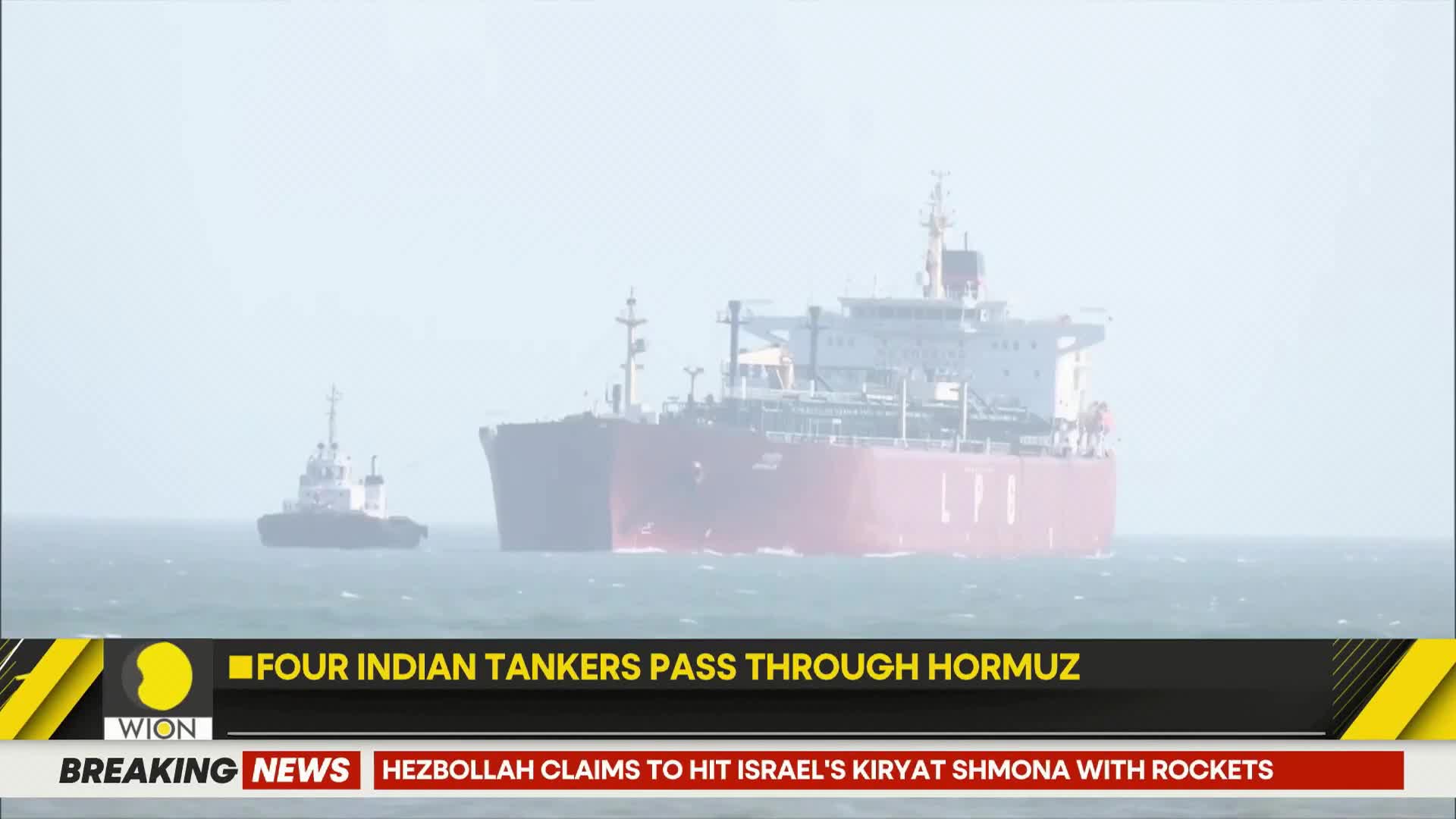 A massive red and white tanker, bearing the "LPG" insignia, moves steadily through the water, guided by a smaller tugboat. This passage through the Strait of Hormuz is a significant event for India, as reported by WION.
