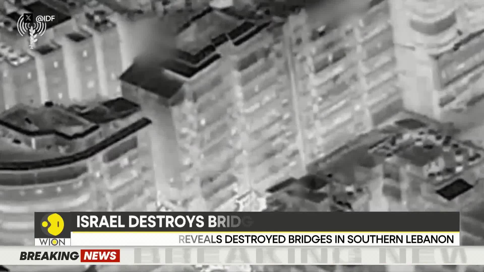 The drone footage captures a stark, thermal-imaging view of buildings and what appears to be a destroyed bridge. WION's breaking news banner scrolls across the bottom, indicating that Israel has destroyed bridges in southern Lebanon.