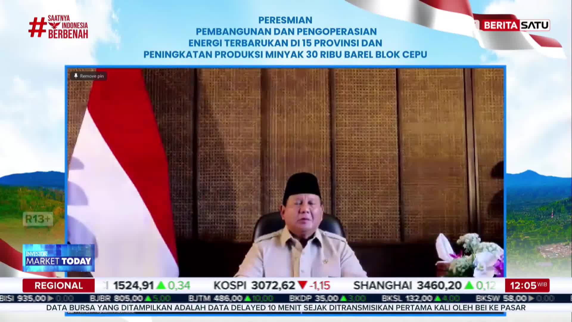 A man in a light-colored shirt is speaking on a screen, framed by the Indonesian flag and a BeritaSatu logo. Below, financial data scrolls across the bottom of the screen.
