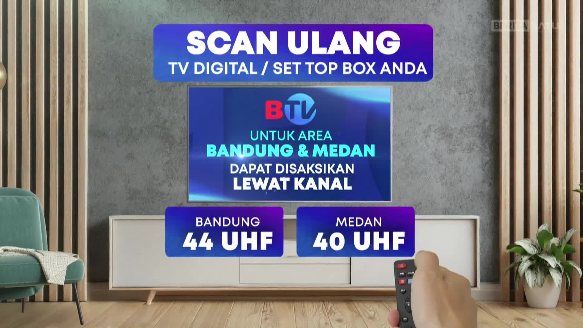 A hand holds a remote, pointing it toward a TV screen displaying a BTV advertisement. The screen indicates that viewers in Bandung and Medan can watch the channel on specific UHF frequencies, as seen on BeritaSatu English.
