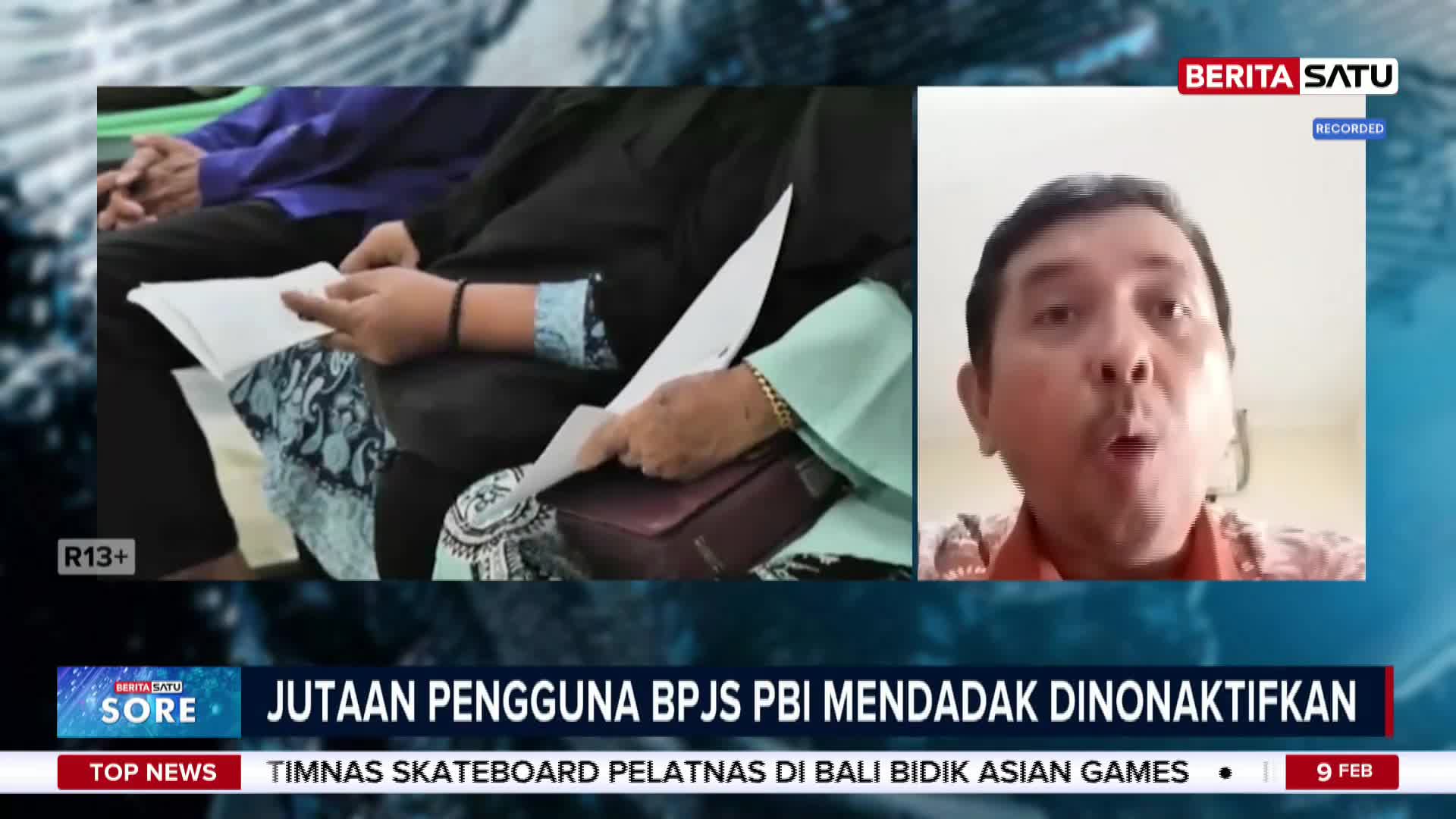A man speaks directly to the camera on Berita Satu, while in the background, hands hold white papers. The screen displays a headline about millions of BPJS PBI users being suddenly deactivated.