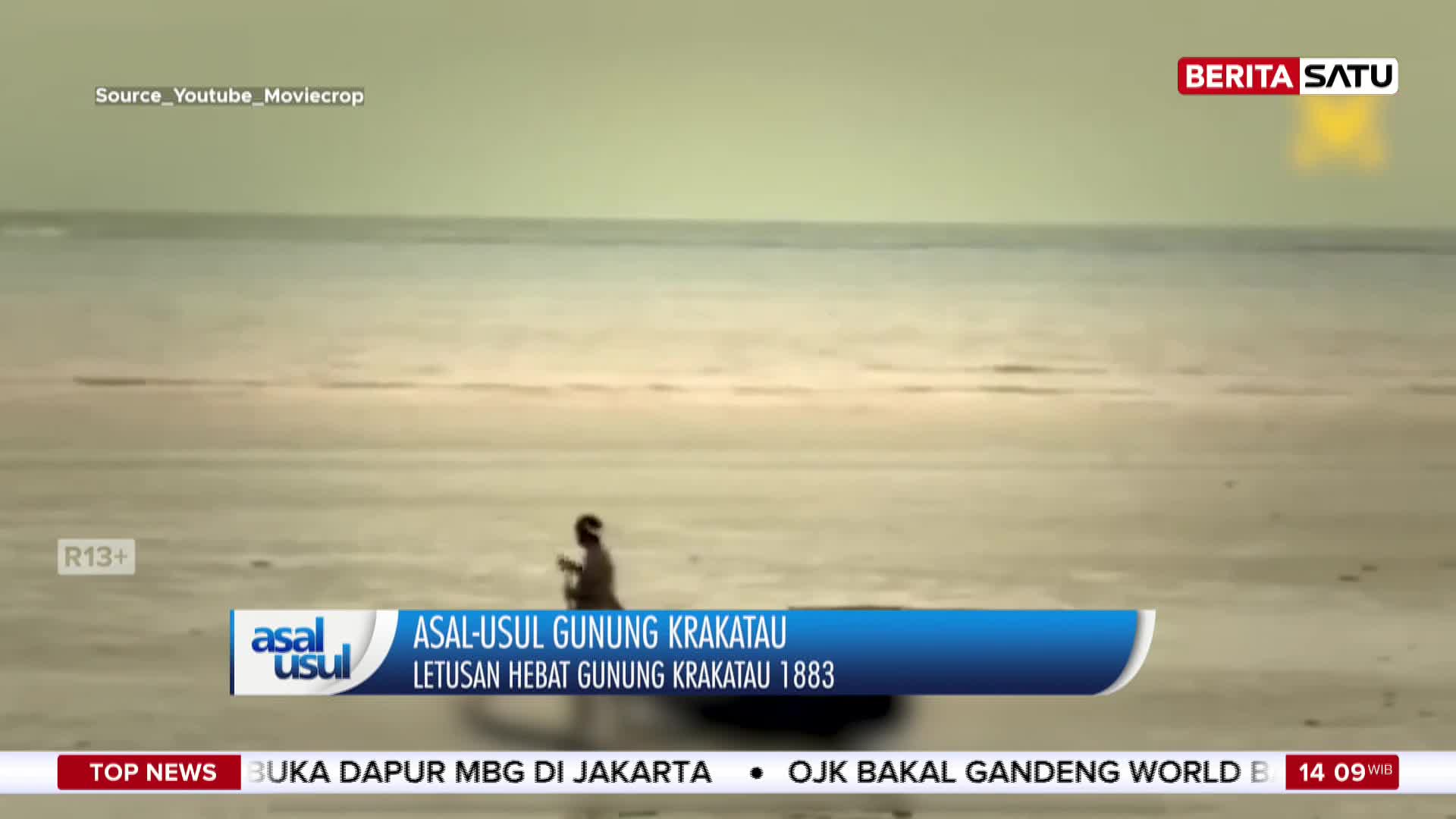 A lone figure walks along a vast, sandy expanse towards the calm sea. BeritaSatu's chyron mentions the origin of Krakatoa and its 1883 eruption.