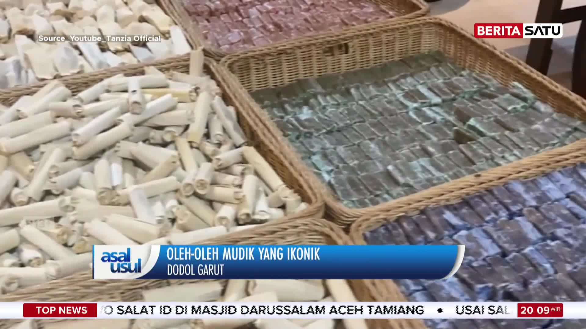 Woven baskets overflow with pale, rolled treats, some appearing dusty. Next to them, neatly arranged rows of dark, rectangular sweets fill another basket.