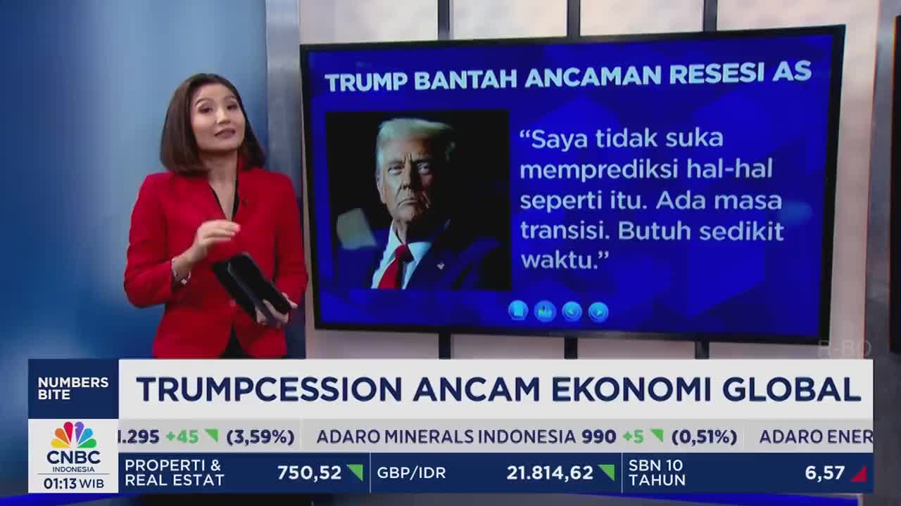 A CNBC Indonesia anchor in a red jacket gestures toward a screen displaying a photo of Donald Trump, with Indonesian text about a recession. The lower third of the screen shows financial data and the headline "TRUMPCESSION ANCAM EKONOMI GLOBAL."

