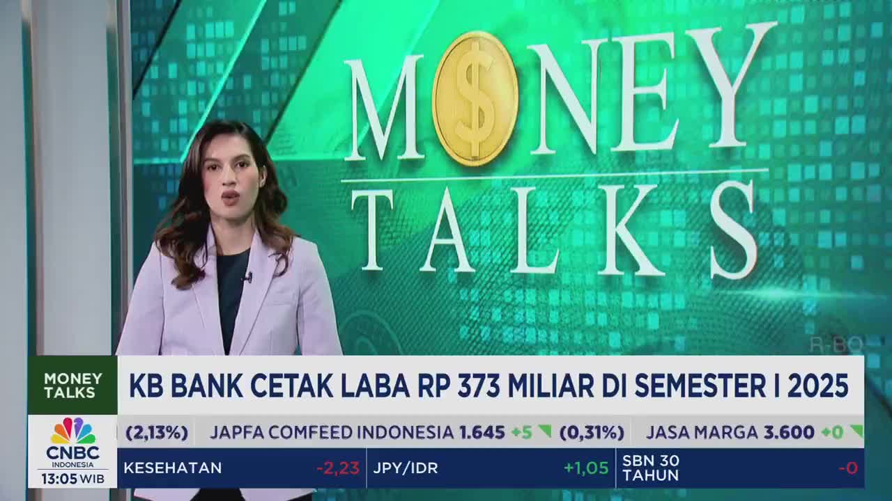 A news anchor in a light purple blazer speaks directly to the camera, framed by the "Money Talks" logo from CNBC Indonesia. Below her, financial data scrolls across the screen.
