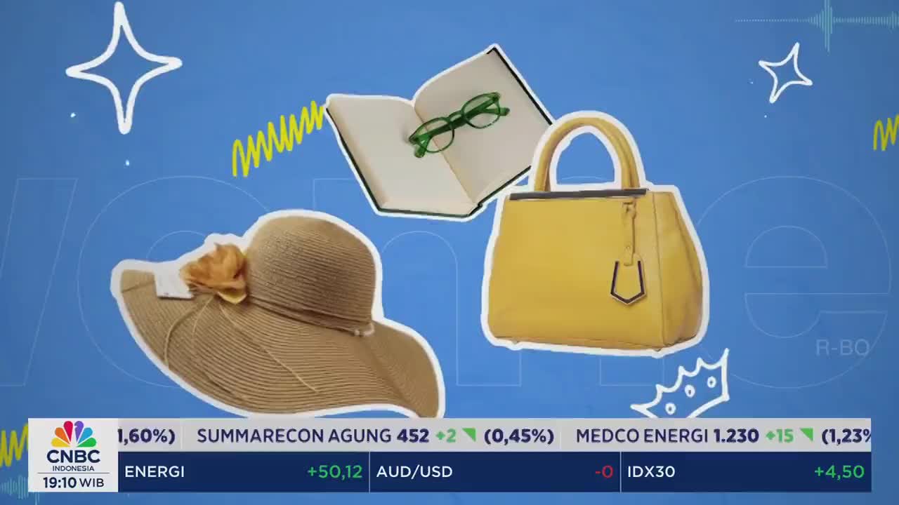 On a blue background, a straw hat, a yellow purse, and an open book with glasses float near the CNBC Indonesia logo. The lower third displays financial data, including stock information.
