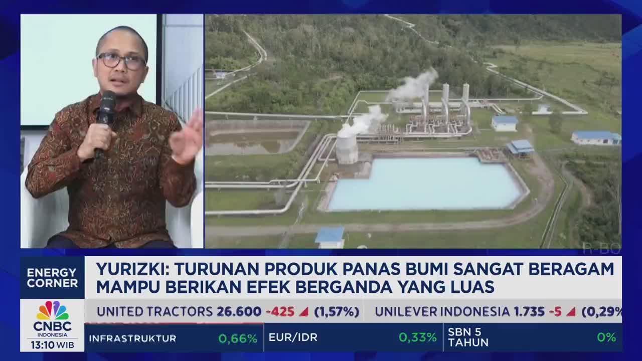 A man in a patterned shirt gestures with his right hand as he speaks into a microphone. Behind him, a CNBC Indonesia graphic displays a geothermal power plant with steam rising from its structures.
