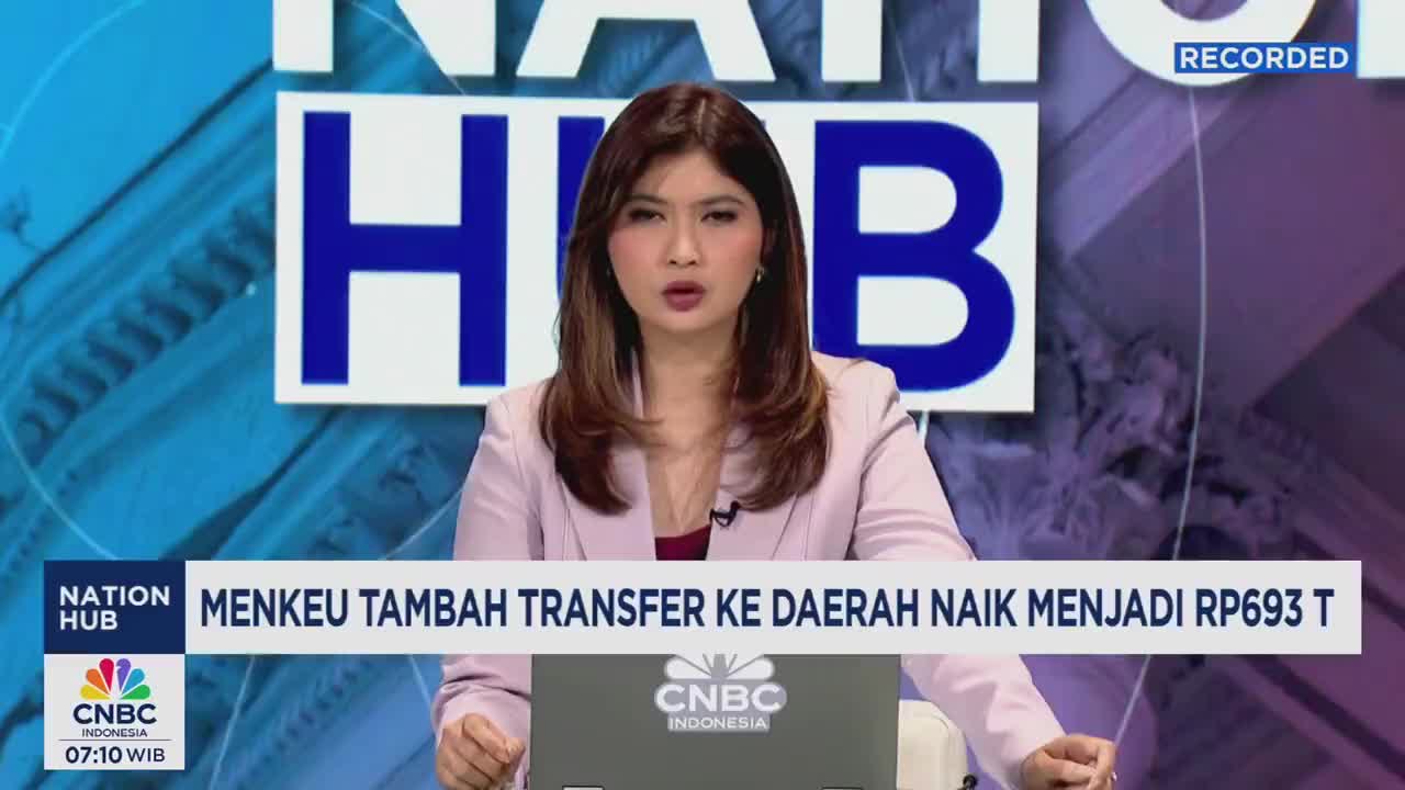A woman in a pink blazer speaks directly to the camera, her expression serious. Behind her, the CNBC Indonesia logo and the "Nation Hub" title are visible on a blue background.
