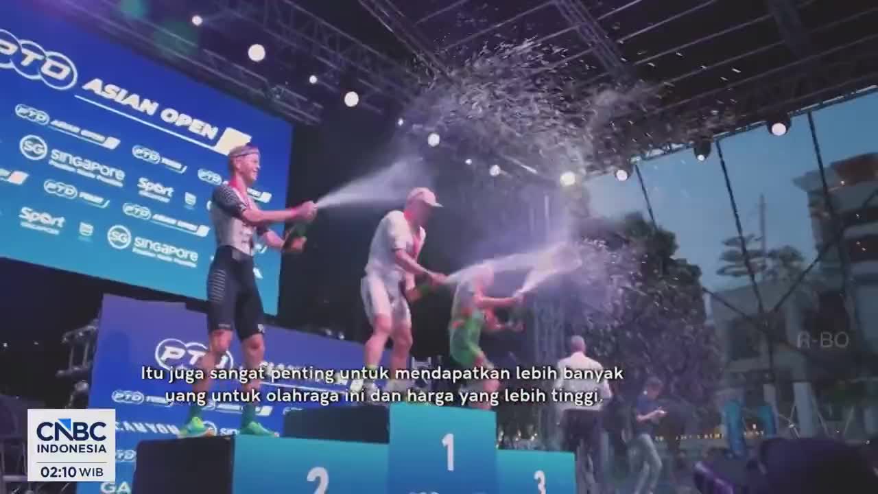Champagne sprays erupt from bottles as athletes celebrate on the podium. The crowd cheers as confetti rains down on the winners of the PTO Asian Open. Champagne sprays erupt from bottles as athletes celebrate on the podium. The crowd cheers as confetti rains down on the winners of the PTO Asian Open.