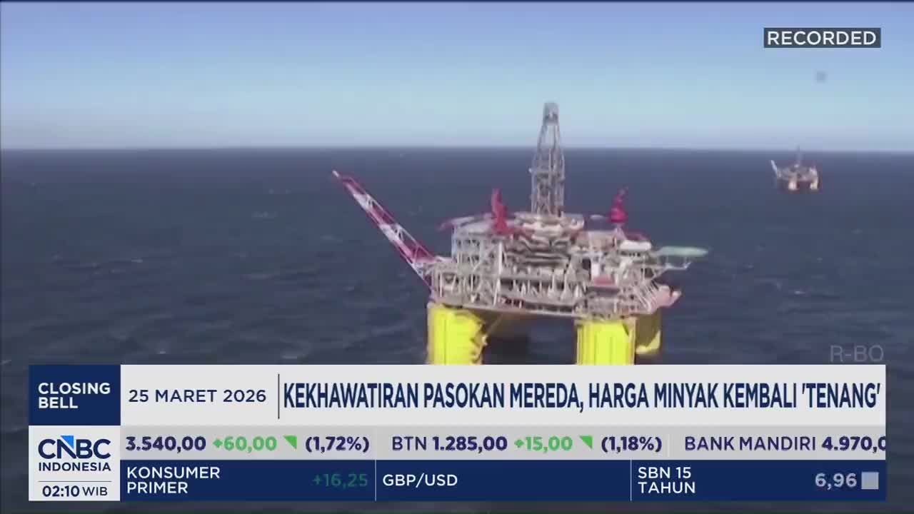 A massive oil rig stands tall against the horizon, its yellow pontoons submerged in the deep blue sea. Another smaller rig is visible in the distance, a testament to the vastness of this offshore operation. A massive oil rig stands tall against the horizon, its yellow pontoons submerged in the deep blue sea. Another smaller rig is visible in the distance, a testament to the vastness of this offshore operation.