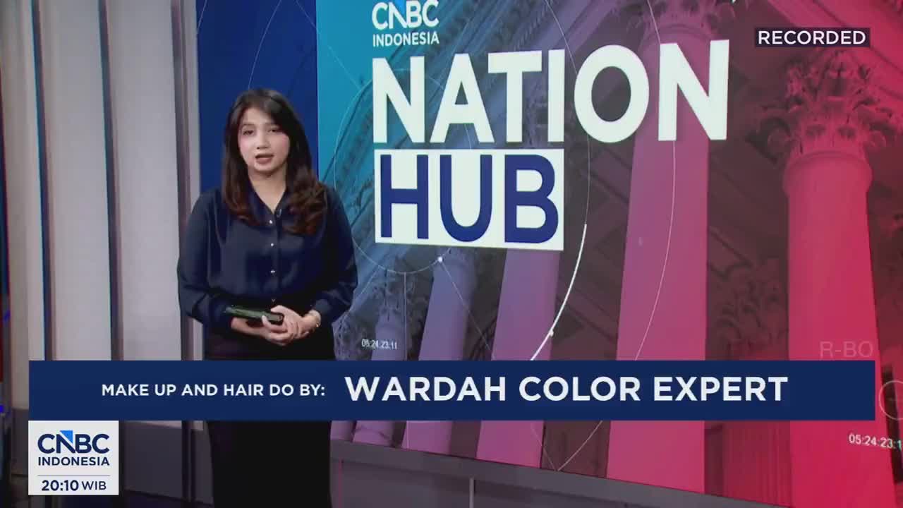 A woman stands by a screen displaying "NATION HUB" in large letters. Below, a blue bar announces "MAKE UP AND HAIR DO BY: WARDAH COLOR EXPERT."