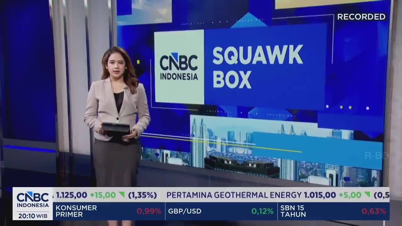 A woman stands in front of a screen displaying "CNBC INDONESIA SQUAWK BOX." Below, a ticker scrolls with financial data. A woman stands in front of a screen displaying "CNBC INDONESIA SQUAWK BOX." Below, a ticker scrolls with financial data.