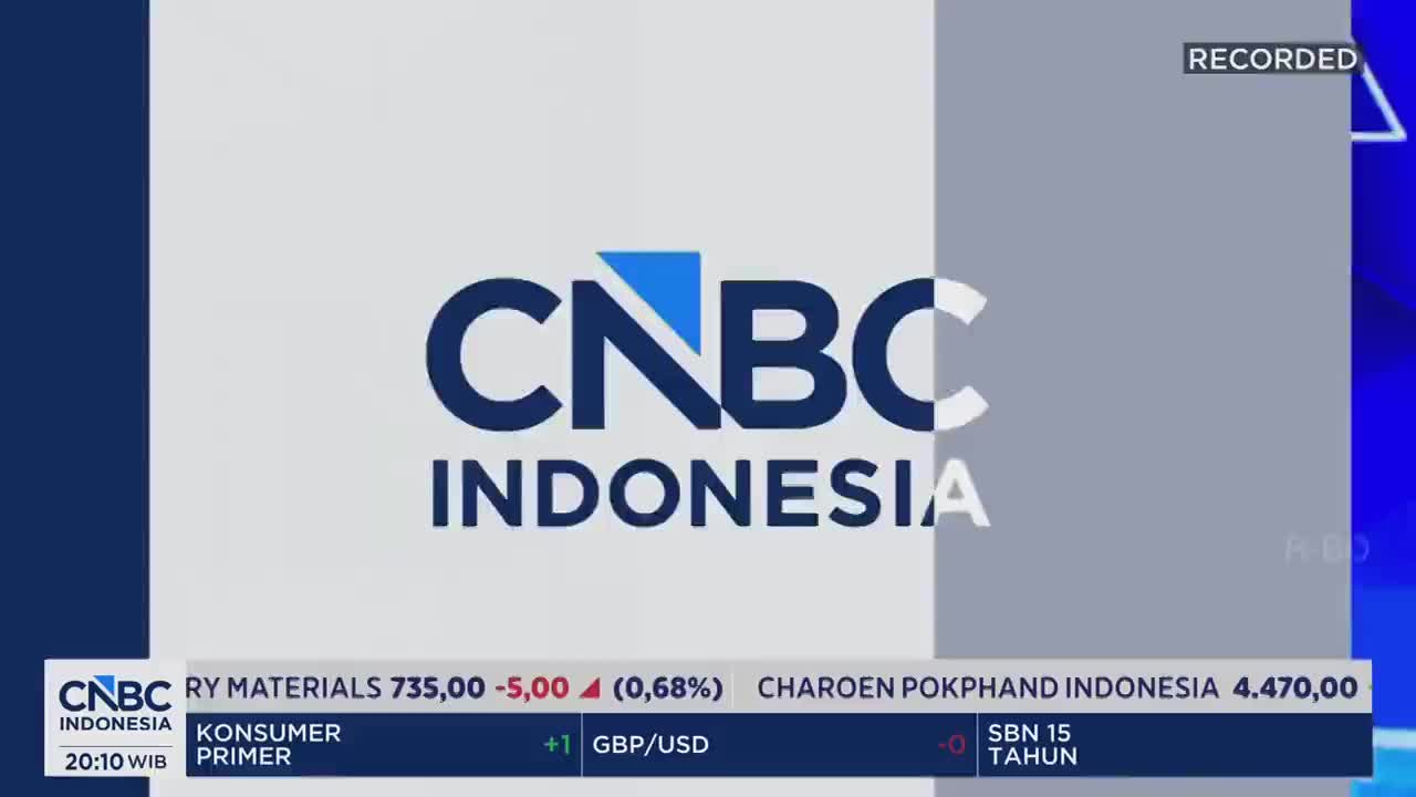 The CNBC Indonesia logo fills the screen, a sharp blue and white against a gray background. Below it, ticker tape scrolls with stock information, including the Indonesian company Charoen Pokphand Indonesia.