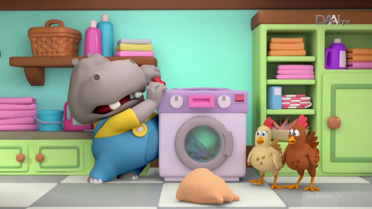 A hippo in blue overalls fiddles with a washing machine, while two chickens watch. The scene is set in a brightly colored laundry room, likely from an Indonesian children's show on DAAI TV.
