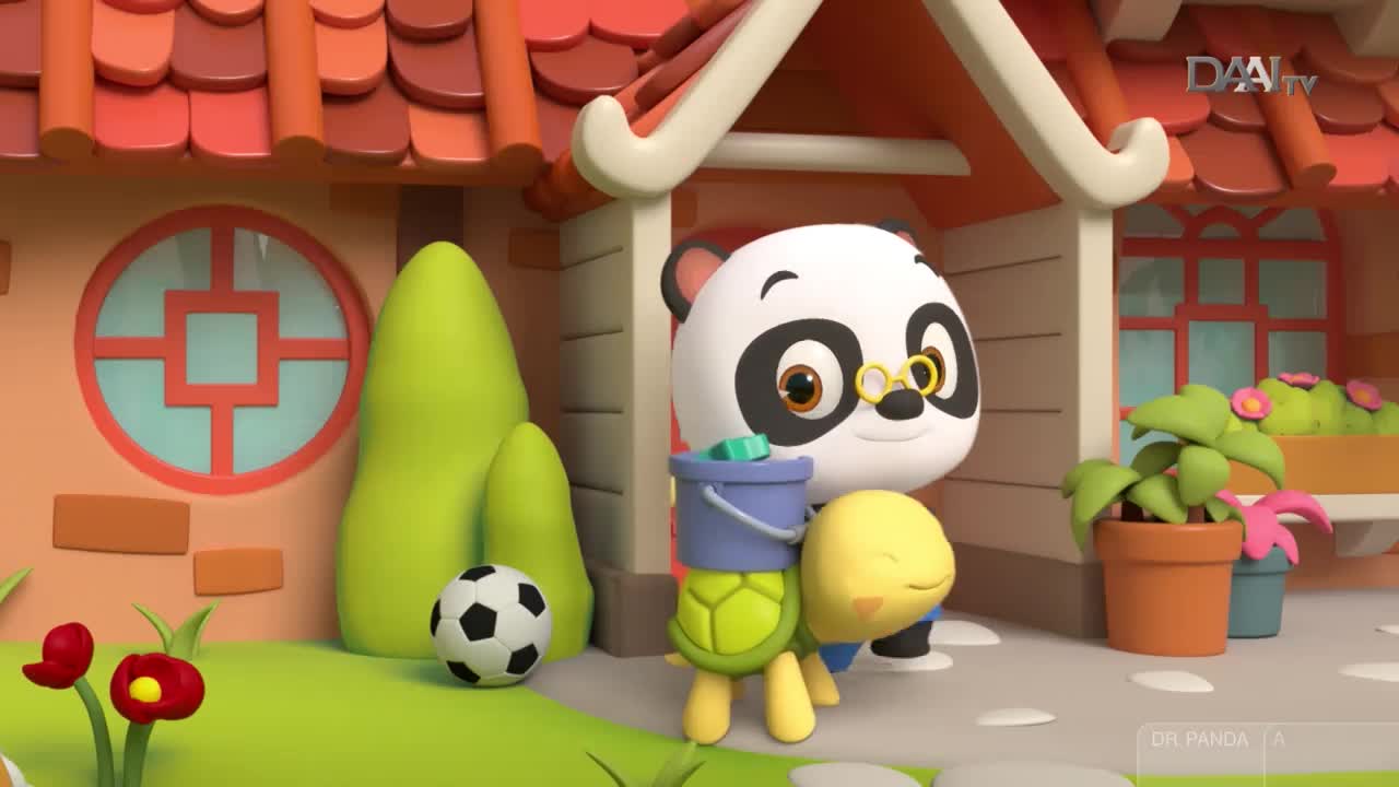 A panda wearing glasses stands with a turtle, both near a house with a soccer ball nearby. The turtle carries a bucket, and the panda looks on with a smile.
