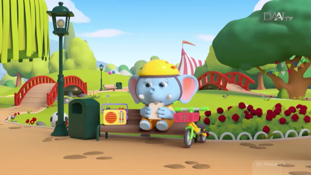 A blue elephant in a yellow helmet sits on a park bench, enjoying a sandwich. Nearby, a yellow tricycle sits, and a radio plays music, likely from DAAI TV in Indonesia.
