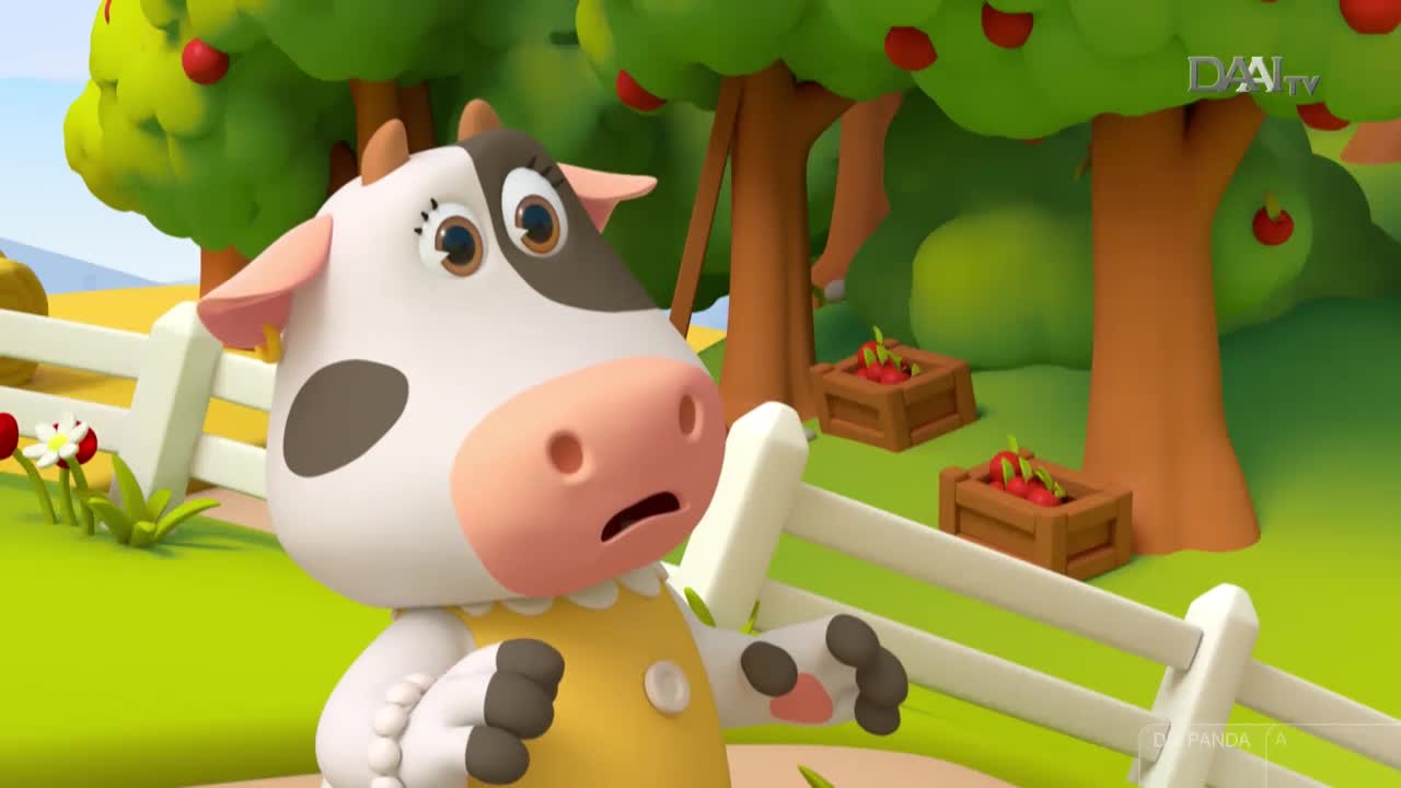 A cartoon cow, with a worried expression, stands near a white picket fence. The scene, likely from DAAI TV in Indonesia, is set in a cartoon orchard, with apple trees and wooden crates.
