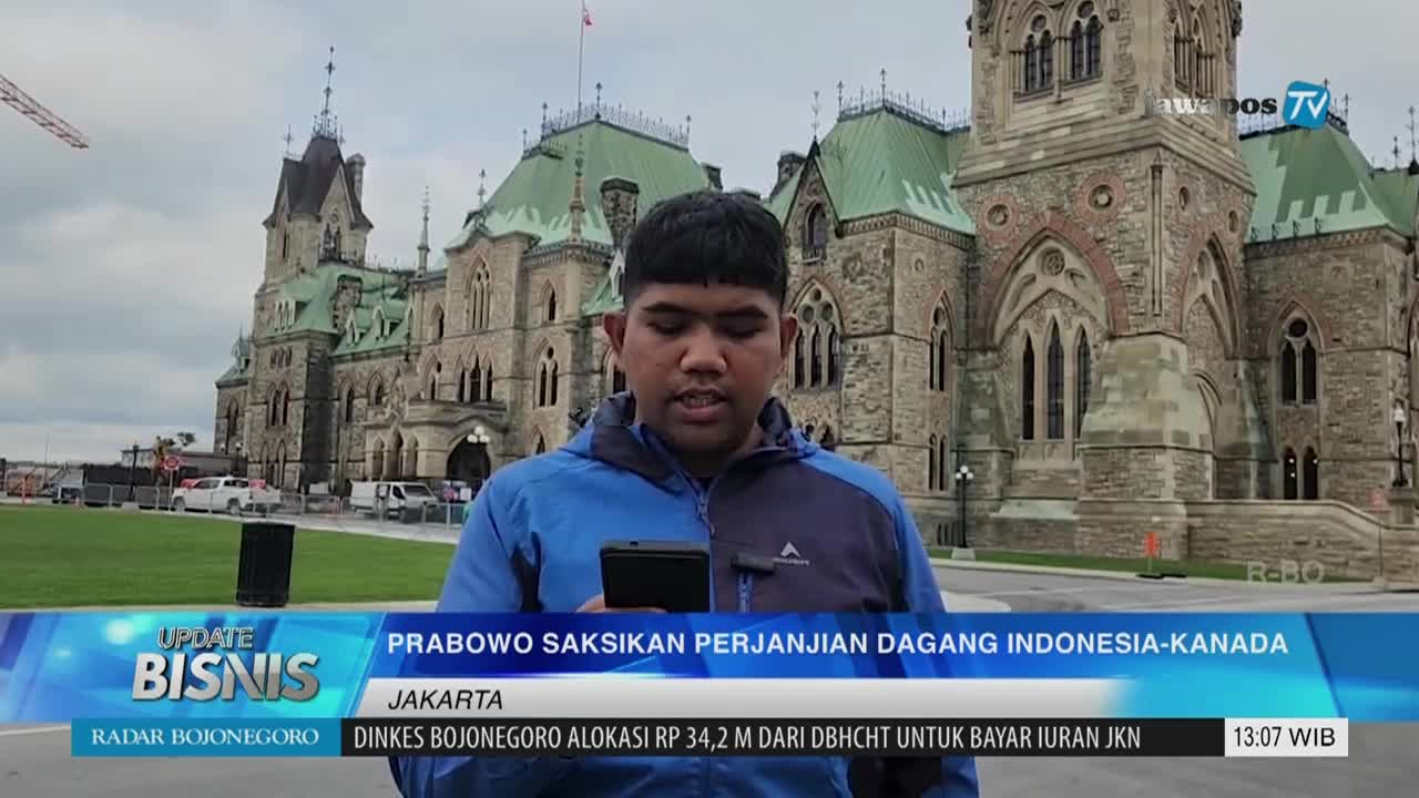 A reporter from Jawa Pos TV in Indonesia stands in front of a large stone building and speaks into a microphone. The news segment is about a trade agreement between Indonesia and Canada.
