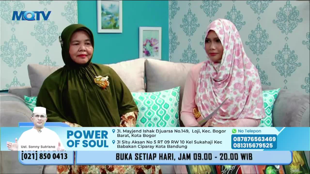 Two women sit on a couch, facing forward on the MQTV set. The program "Power of Soul" is advertised at the bottom of the screen, with a man in a white cap also visible.
